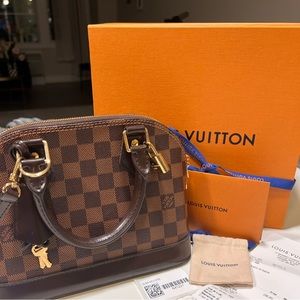 Louis Vuitton Alma BB  crossbody bag, like new! Authentic! With all paperwork!